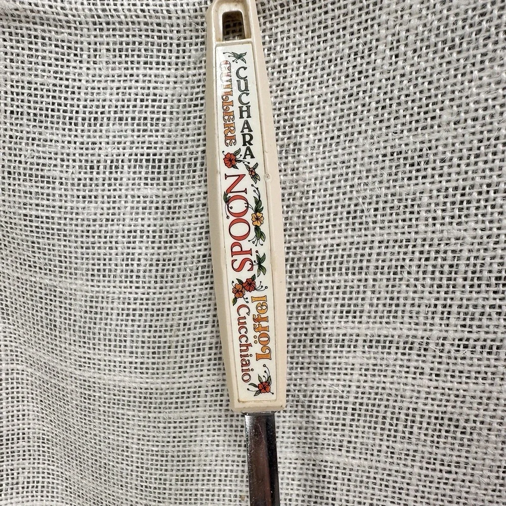 EKCO USA Slotted Spoon Floral Handle Multilingual 